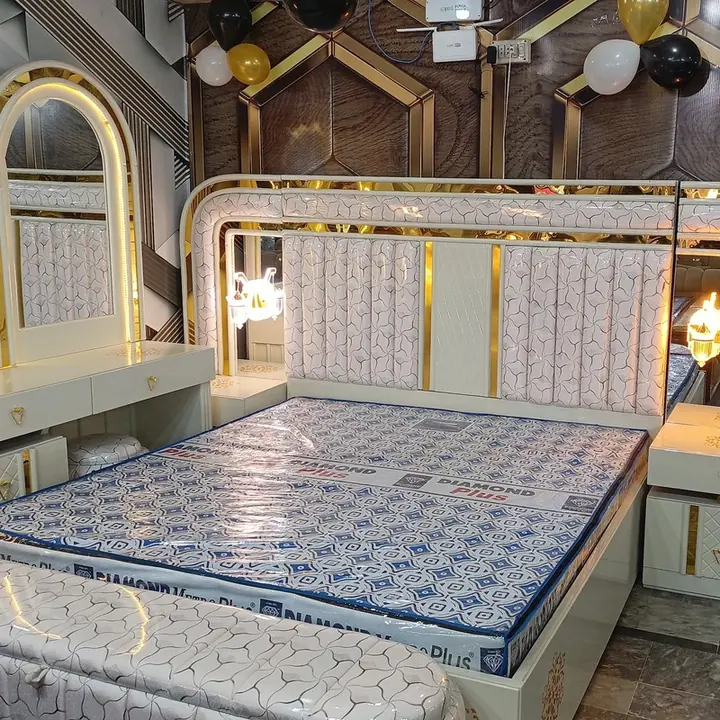 White and gold bed at Arshad Furniture House