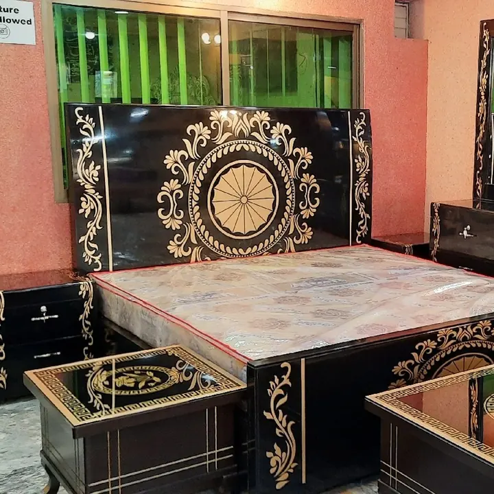 Black and gold bedroom set at Arshad Furniture House