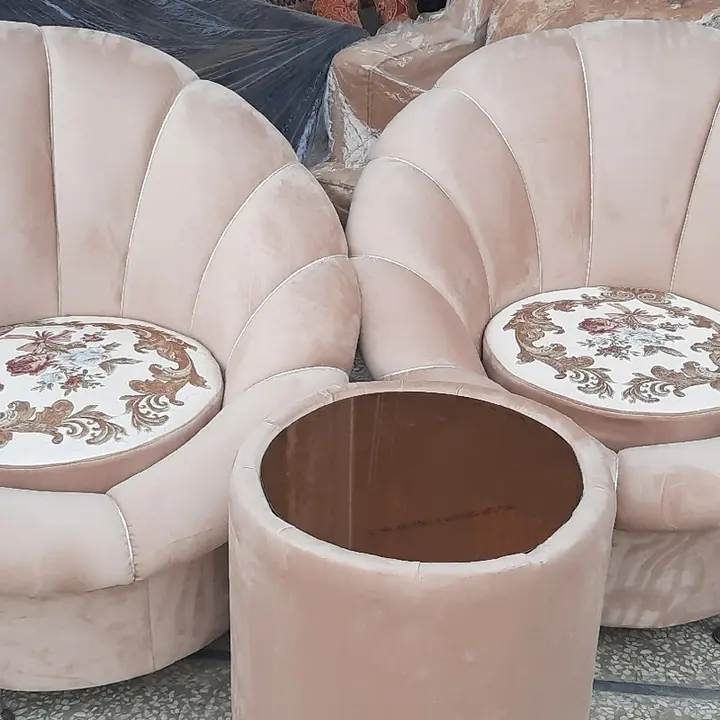 Shell chairs with pouf at Arshad Furniture House