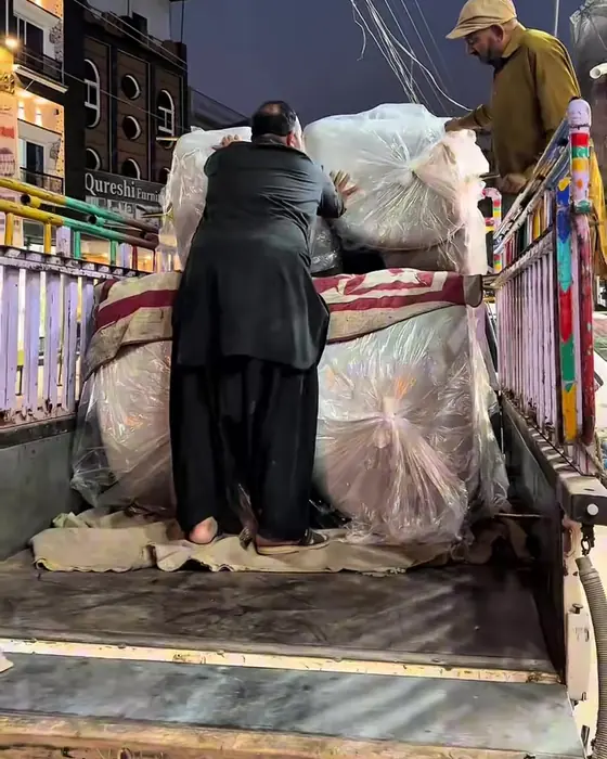 Furniture being loaded for delivery to Kallar Syedan